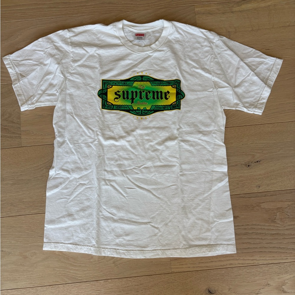 Supreme White T-Shirt with Red Logo Tag